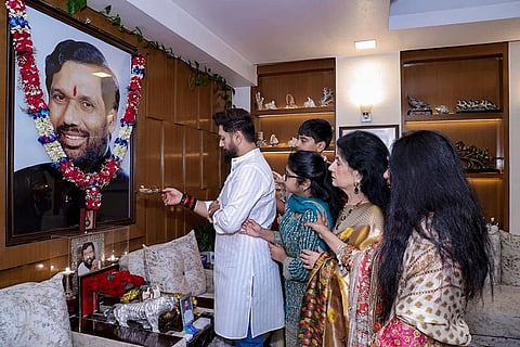In this image posted on July 5, 2026, Union Minister Chirag Paswan pays tribute to Lok Janshakti Party (Ram Vilas) founder and his father Ram Vilas Paswan on the latter's birth anniversary.