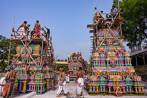 People participate in the 'Punaruddharana Maha Kumbabhishekam' ritual of the 'Sri Swaminatha Swamy Temple', at Uttara Swami Malai Temple, in New Delhi.