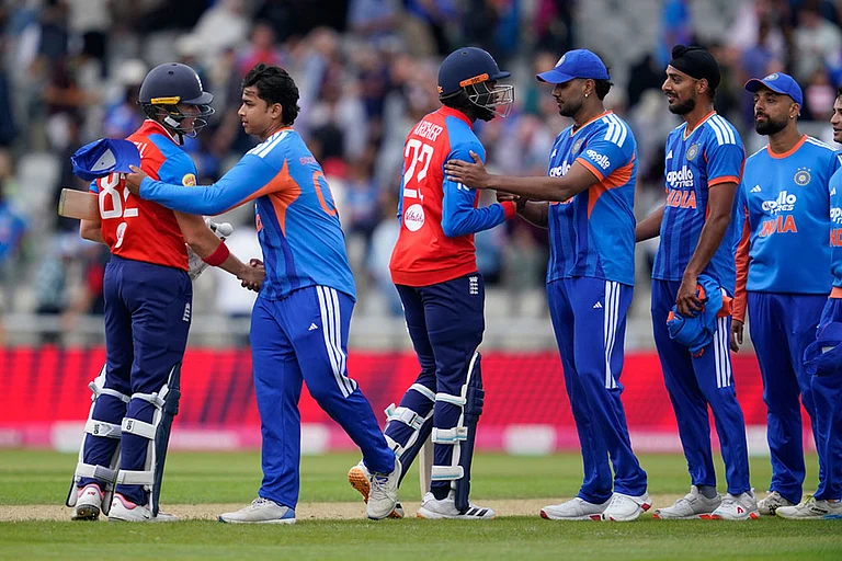England's Jacob Bethell, left, and Jofra Archer, third left, shake hands with India's Vaibhav Sooryavanshi , second left, and Harshit Rana after winning the second T20 cricket match between England and India in Manchester, England. - | Photo: AP/Dave Thompson