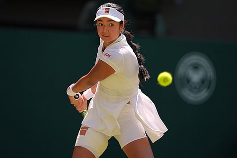Alexandra Eala of the Philippines plays a return during the third round women's singles match against Iga Swiatek of Poland at the Wimbledon Tennis Championships in London.