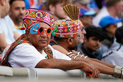 Indian fans in traditional attire watch the second T20 cricket match between England and India in Manchester, England.