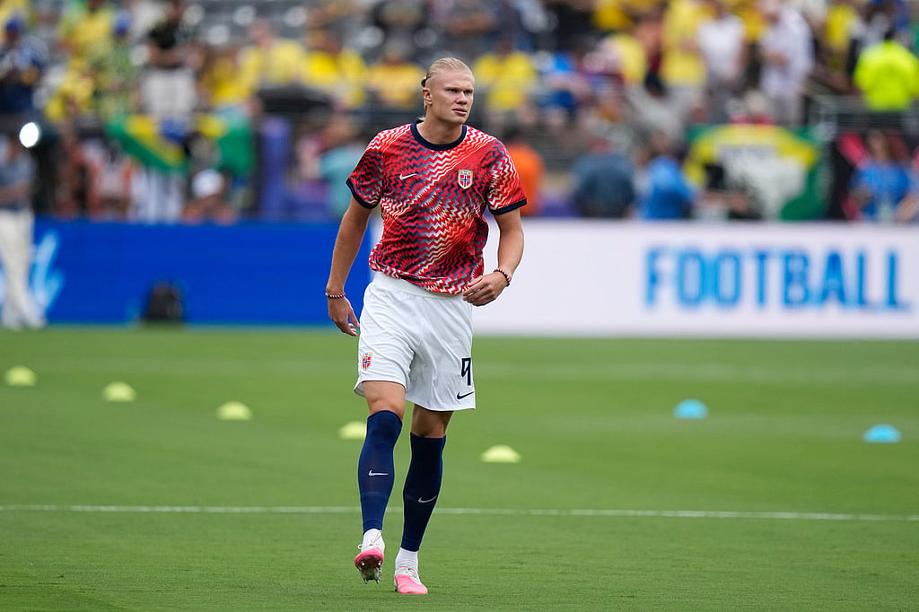 Norways Erling Haaland (9) walks on the pitch ahead of the World Cup round of 16 soccer match between Brazil and Norway in East Rutherford,