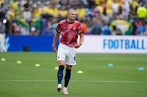 Norway's Erling Haaland (9) walks on the pitch ahead of the World Cup round of 16 soccer match between Brazil and Norway in East Rutherford,