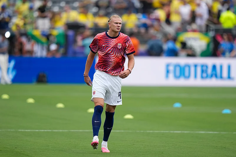 Norways Erling Haaland (9) walks on the pitch ahead of the World Cup round of 16 soccer match between Brazil and Norway in East Rutherford,