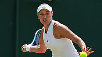 (AP Photo/Maja Smiejkowska) : Jessica Pegula of the United States plays a return during the third round women's singles match against Jessica Bouzas Maneiro of Spain at the Wimbledon Tennis Championships in London, Friday, July 3, 2026.