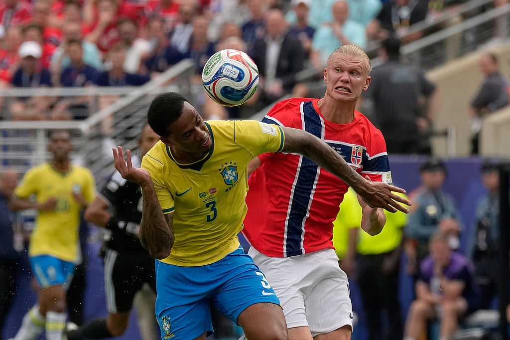 Brazils Gabriel Magalhaes (3) heads the ball away from Norways Erling Haaland during the World Cup round of 16 soccer match between Brazil and Norway in East Rutherford