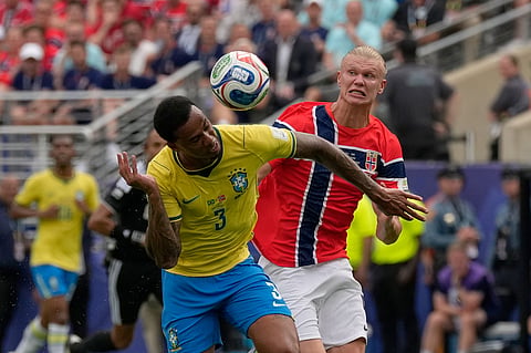 Brazil's Gabriel Magalhaes (3) heads the ball away from Norway's Erling Haaland during the World Cup round of 16 soccer match between Brazil and Norway in East Rutherford