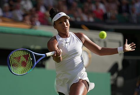 Naomi Osaka of Japan returns the ball to Aryna Sabalenka of Belarus in their fourth round women's singles match at the Wimbledon Tennis Championships in London, Sunday, July 5, 2026. 