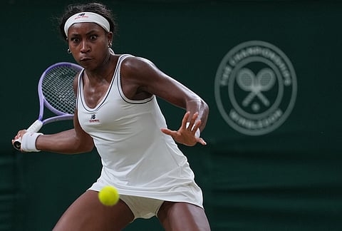 Coco Gauff of the United States returns the ball to Belinda Bencic of Switzerland in their fourth round women's singles match at the Wimbledon Tennis Championships in London, Sunday, July 5, 2026. 