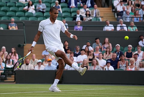 Felix Auger-Aliassime of Canada kicks the ball during the men's singles fourth round match against Alejandro Davidovich Fokina of Spain at the Wimbledon Tennis Championships in London, Sunday, July 5, 2026.