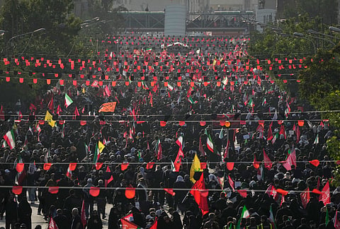 Mourners fill a boulevard as they make their way to the funeral procession of the slain Iranian Supreme Leader Ayatollah Ali Khamenei in Tehran, Iran, Monday, July 6, 2026.