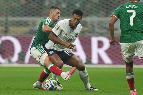 England's Jude Bellingham (10) battles for the ball with Mexico's Erik Lira (6) during the World Cup round of 16 soccer match between Mexico and England in Mexico City, Sunday, July 5, 2026