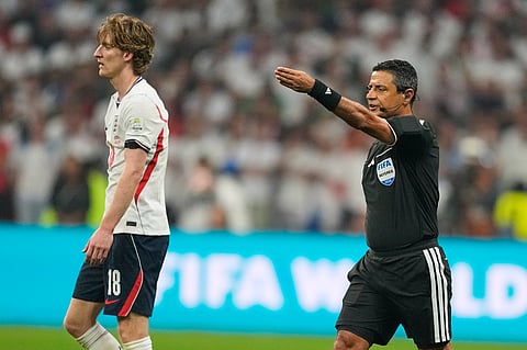 Referee Alireza Faghani of Australia gestures for a penalty to Mexico during the World Cup round of 16 soccer match between Mexico and England in Mexico City, Sunday, July 5, 2026