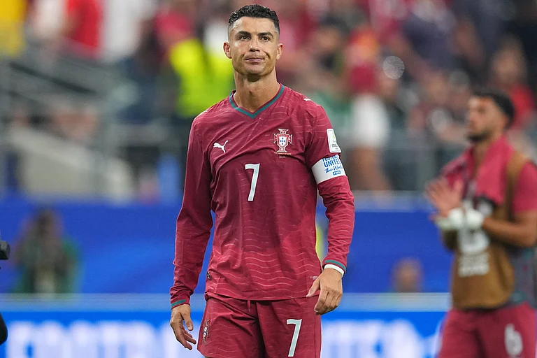 Portugal's Cristiano Ronaldo (7) leaves the pitch after the World Cup round of 16 soccer match between Portugal and Spain. - AP