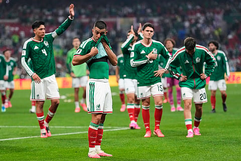 Mexico players react following the World Cup round of 16 soccer match between Mexico and England in Mexico City, Sunday, July 5, 2026