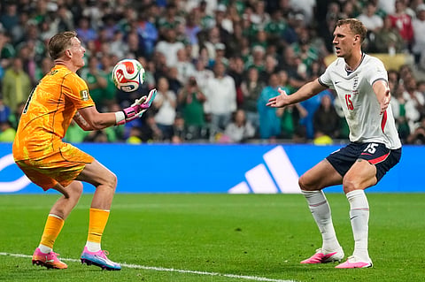 England's Dan Burn (15) reacts as goalkeeper Jordan Pickford (1) takes the ball during the World Cup round of 16 soccer match between Mexico and England in Mexico City, Sunday, July 5, 2026