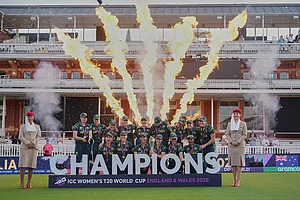 | Photo: AP/Alastair Grant : The Australia team celebrate with the trophy after winning the Women's T20 Cricket World Cup final between England and Australia in London.