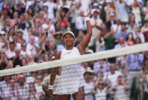Naomi Osaka of Japan celebrates her victory against Aryna Sabalenka of Belarus in their fourth round women's singles match at the Wimbledon Tennis Championships in London, Sunday, July 5, 2026. 