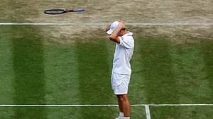 AP : Arthur Fery received a standing ovation from Roger Federer after winning against Dimitrov.