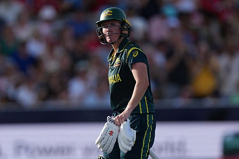 Australia's Beth Mooney, walks off the pitch after being given out lbw, during the Women's T20 Cricket World Cup final between England and Australia in London.