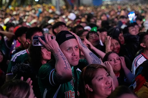 Fans react after England scored its second goal during the World Cup round of 16 soccer match between Mexico and England in Mexico City, Sunday, July 5, 2026