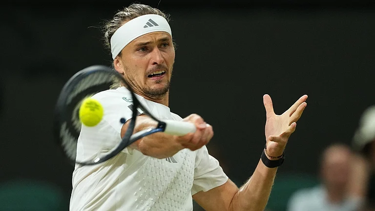 Alexander Zverev of Germany plays a return during the men's singles fourth round match against Jiri Lehecka of the Czech Republic at the Wimbledon Tennis Championships in London, Monday, July 6, 2026. - AP