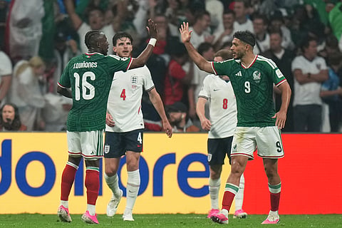 Mexico's Julian Quinones, left, celebrates with Raul Jimenez after scoring his side's first goal during the World Cup round of 16 soccer match between Mexico and England in Mexico City, Sunday, July 5, 2026