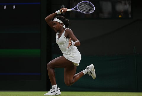 Coco Gauff of the United States returns the ball to Belinda Bencic of Switzerland in their fourth round women's singles match at the Wimbledon Tennis Championships in London, Sunday, July 5, 2026.