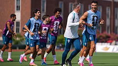 Portugal's Cristiano Ronaldo, right, talks with team performance manager Richard Evans during a training session ahead of the team's World Cup round of 16 soccer match against Spain, Sunday, July 5, 2026, in Dallas. - AP Photo/Julio Cortez
