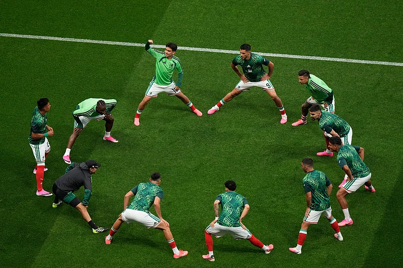 Mexico warms up before their World Cup round of 16 soccer match against England in Mexico City