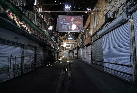 Shops are closed in Tehran old main bazaar due to the dayslong funeral ceremonies for the late Iranian Supreme Leader Ayatollah Ali Khamenei, shown in the banner on top, and members of his family, who were killed during the U.S. and Israel strike on Feb. 28, Iran, Saturday, July 4, 2026. 