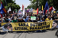 GERARD CARREON
PHOTOJOURNALIST : Protesters carry a banner calling for the impeachment of Philippine Vice President Sara Duterte during a protest in Philippines 

