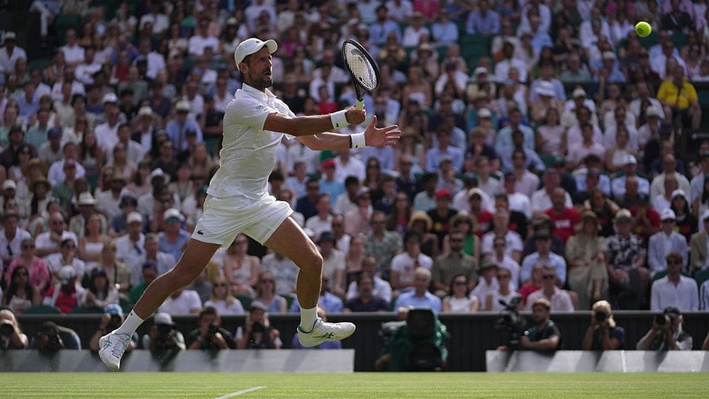 Novak Djokovic of Serbia returns the ball to Roman Saffiulin of Russia in their fourth round men's singles match at the Wimbledon Tennis Championships in London. - Photo: AP/Brian Inganga