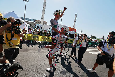 Mexico's Isaac Del Toro, left, celebrates with Slovenia's Tadej Pogacar after he won the second stage of the Tour de France cycling race over 168.5 kilometers (104.3 miles) with start in Tarragona and finish in Barcelona, Spain, Sunday, July 5, 2026. 