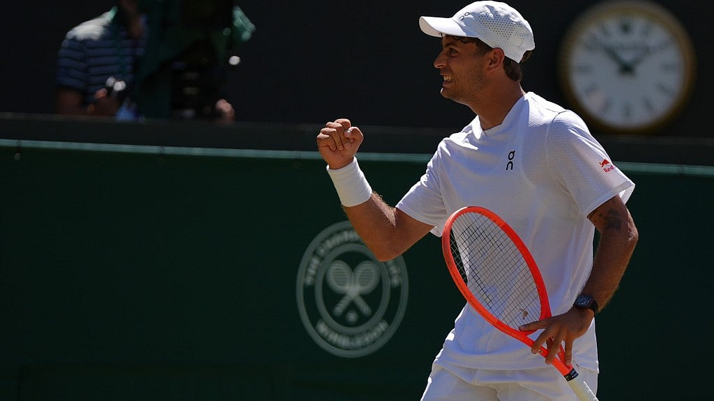 Flavio Cobolli of Italy celebrates winning the first set against Alex de Minaur of Australia in their fourth round men's singles match at the Wimbledon Tennis Championships in London, Monday, July 6, 2026. - AP Photo/Maja Smiejkowska