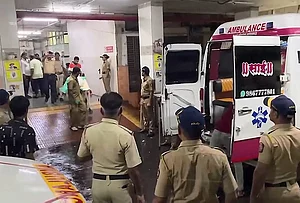 | Photo: PTI : Police personnel and others at a hospital where victims were brought after a three-storey chawl, row tenement, collapsed amid heavy monsoon rains, at Mankhurd area, in Mumbai, Maharashtra. At least six persons were killed and one sustained injuries in the incident on Sunday night.