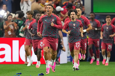 Portugal's Cristiano Ronaldo, front, and teammates enter to the pitch prior to the World Cup round of 16 soccer match