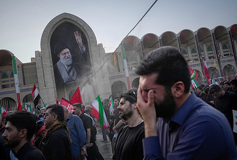 A mourner weeps during the funeral ceremonies for slain Iranian Supreme Leader Ayatollah Ali Khamenei and members of his family at the Imam Khomeini Mosalla Grand Mosque in Tehran, Iran, Saturday, July 4, 2026. 
