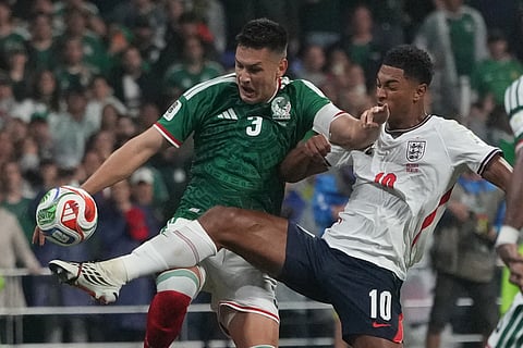 England's Jude Bellingham (10) battles for the ball with Mexico's Cesar Montes (3) during the World Cup round of 16 soccer match between Mexico and England in Mexico City, Sunday, July 5, 2026