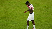 Jeff Chiu/AP Photo : United States' Folarin Balogun (20) walks off the field after receiving a red card during the World Cup round of 32 soccer match between the United States and Bosnia in Santa Clara
