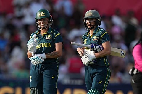 Australia's Ellyse Perry, and Australia's Ashleigh Gardner, celebrate as they win the Women's T20 Cricket World Cup final between England and Australia in London.