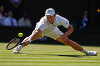 Photo: AP/Kirsty Wigglesworth : Arthur Fery of Britain plays a return during the men's singles fourth round match against Grigor Dimitrov of Bulgaria at the Wimbledon Tennis Championships in London.