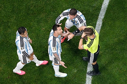 Argentina's Lionel Messi argues with referee Francois Letexier during the World Cup round of 16 soccer match between Argentina and Egypt in Atlanta, Tuesday, July 7, 2026.