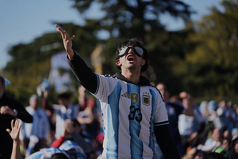 A fan watches the World Cup round of 16 soccer match between Argentina and Egypt in Buenos Aires, Argentina, Tuesday, July 7, 2026.
