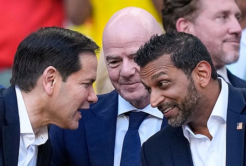 United States Secretary of State, Marco Rubio, left, talks to the Director of the FBI, Kash Patel, right, as FIFA President Gianni Infantino, centre, watches ahead of the World Cup Group K soccer match between Colombia and Portugal in Miami Gardens, Florida, Saturday, June 27, 2026. 