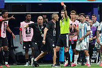 (AP Photo/Colin Hubbard) : Referee Francois Letexier, of France, shows a red card to a staff member of the Egyptian team after Argentina scored their third goal during the World Cup round of 16 soccer match between Argentina and Egypt in Atlanta, Tuesday, July 7, 2026.