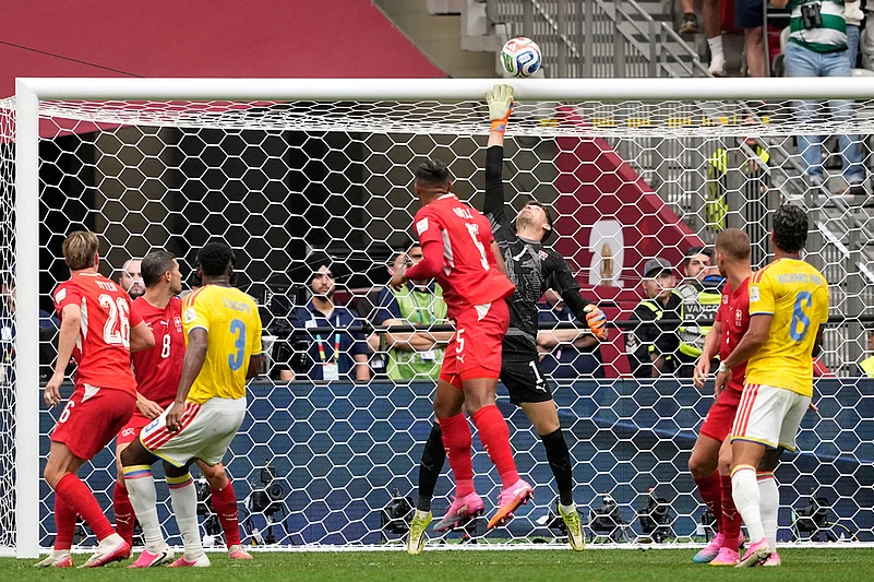 Switzerlands Gregor Kobel clears the ball during the World Cup round of 16 soccer match between Switzerland and Colombia in Vancouver, British Columbia,