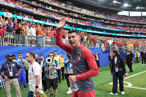 Portugal's Cristiano Ronaldo (7) waves to fans after the World Cup Group K soccer match between Portugal and Uzbekistan in Houston, June 23, 2026.