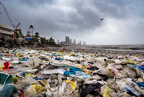 Waste washed ashore following a high tide at Dadar Beach, in Mumbai, Tuesday, July 7, 2026. 