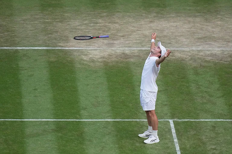 Arthur Fery of Britain celebrates winning against Grigor Dimitrov of Bulgaria in their fourth round men's singles match at the Wimbledon Tennis Championships in London. - | Photo: AP/Brian Inganga